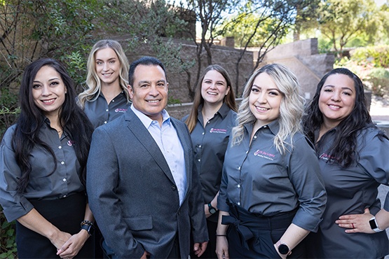 Tucson dentist and dental team members smiling outdoors