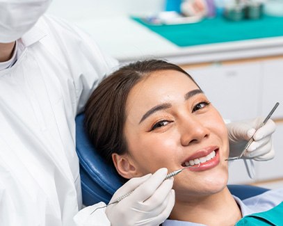 Woman smiling in the dental chair