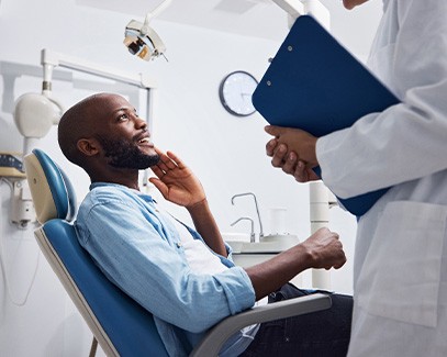 Man smiling at the dentist