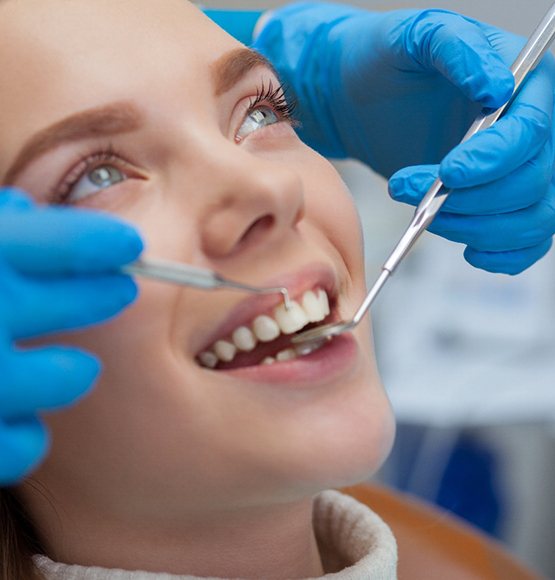 A woman undergoing a dental checkup