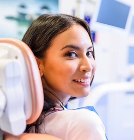 Female dental patient looking back and smiling