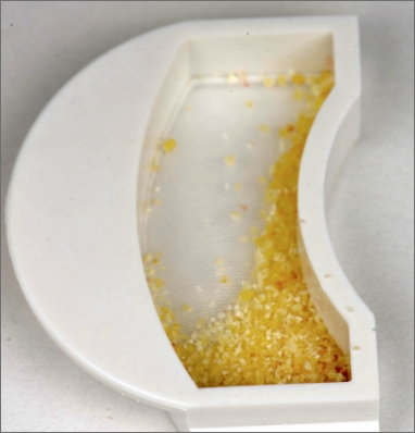 Tooth being ground and sorted