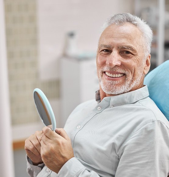 patient smiling in treatment chair 