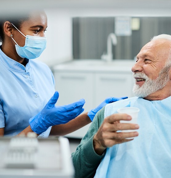 patient learning about digital dentures