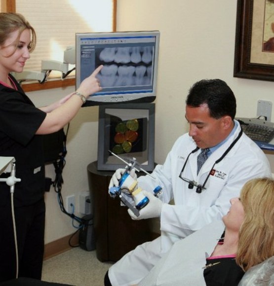 Doctor Lopez showing patient smile model