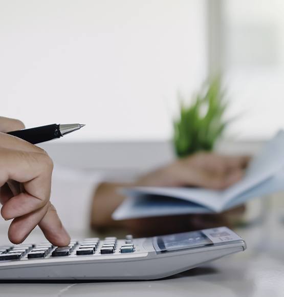 Man using a calculator