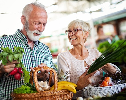 older couple shopping for healthy food