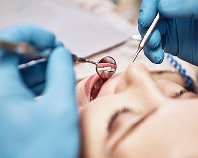 young woman getting dental checkup