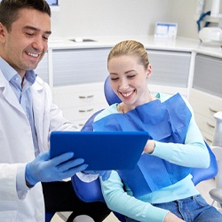 dentist and patient discussing the cost of dental implants in Tucson