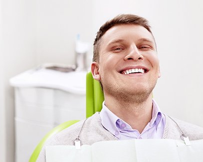 man smiling at dental office 