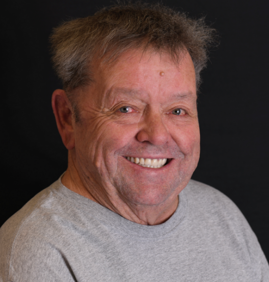 Patient smiling after procedures by Dr. Lopez