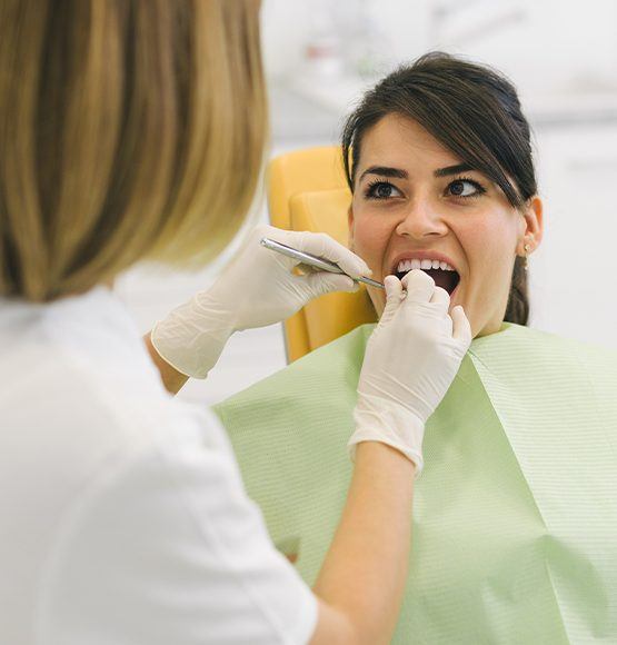 Patient receiving scaling and root planing periodontal therapy