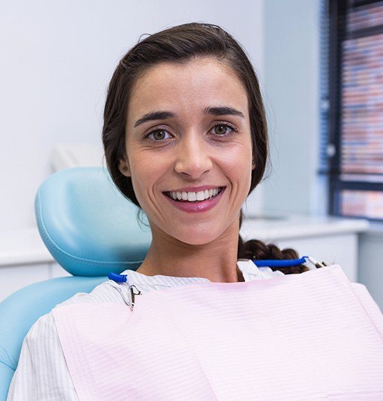 Woman smiling during preventive dentistry checkup visit