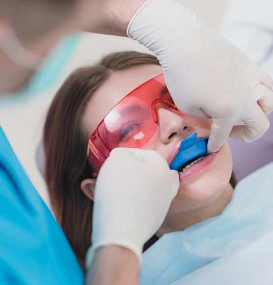 Patient receiving fluoride treatment