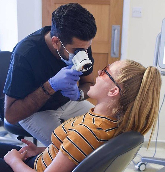 Patient receiving oral cancer screening