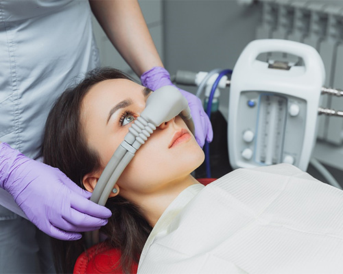 Patient with nitrous oxide dental sedation nose mask in place