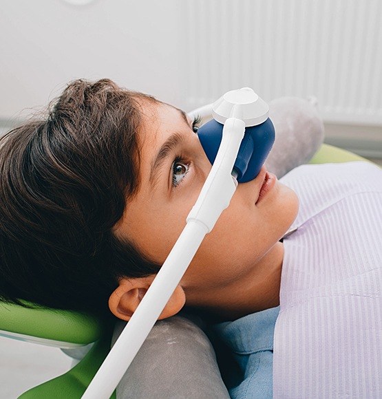 Patient with nitrous oxide dental sedation nose mask in place