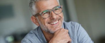 Man smiling after wisdom tooth extraction