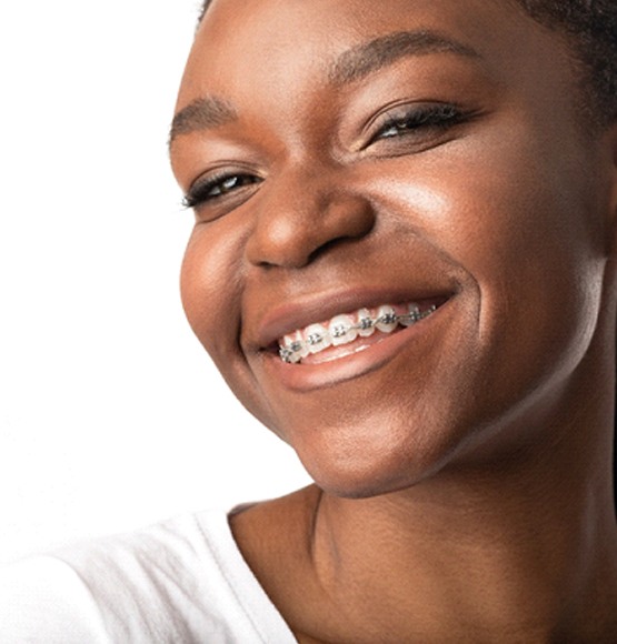 Smiling young woman with braces in Tucson