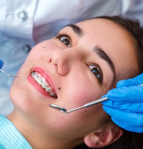 Woman smiles after getting braces in Tucson