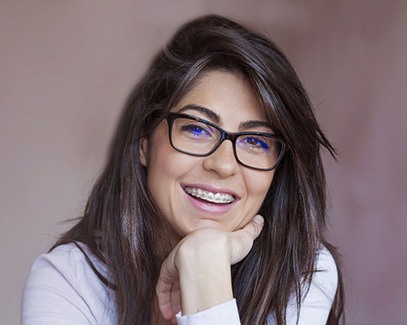 Woman smiling with braces in Tucson