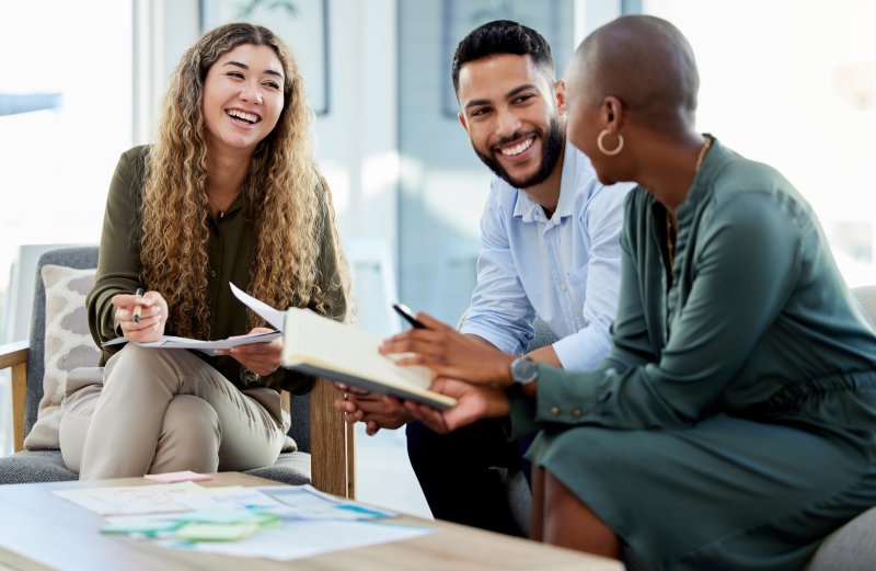 Patient talking with coworkers after dental implant surgery