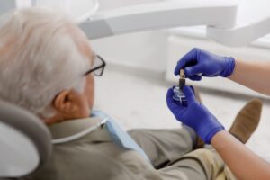 Dentist and patient talking about dental implants
