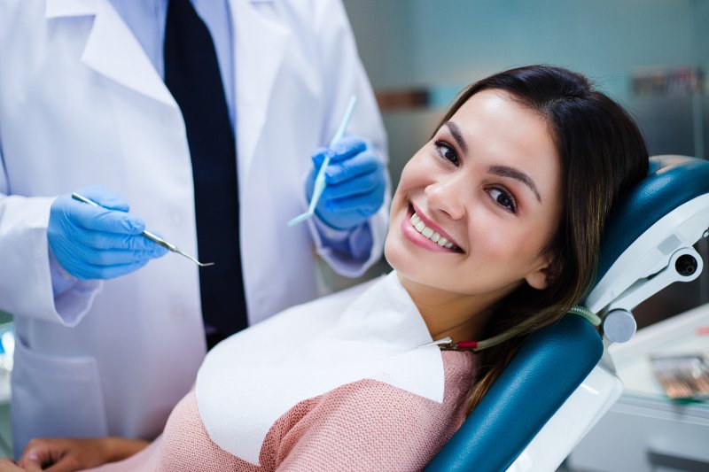 young woman smiling in the treatment chair